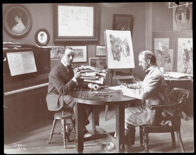 Michel Jacobs and Benson playing dominoes by Byron Company